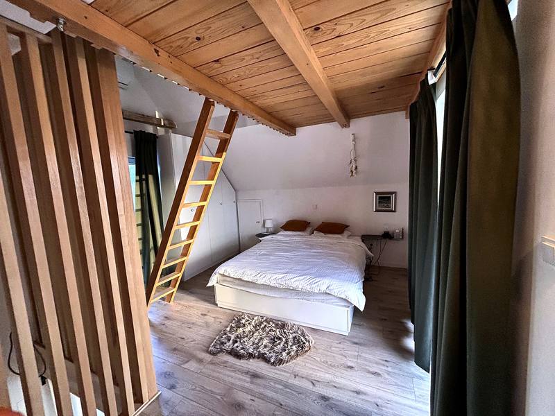 Attic bedroom under wooden beams