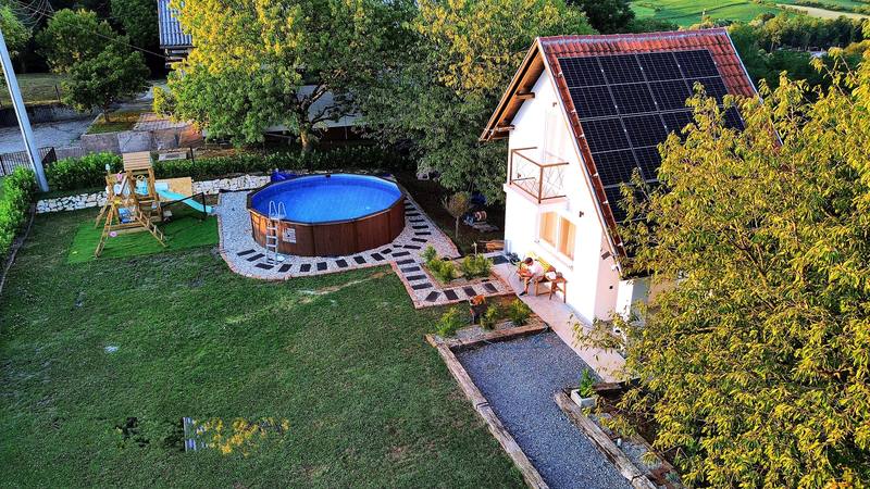 Outdoor pool and children's playground in summer