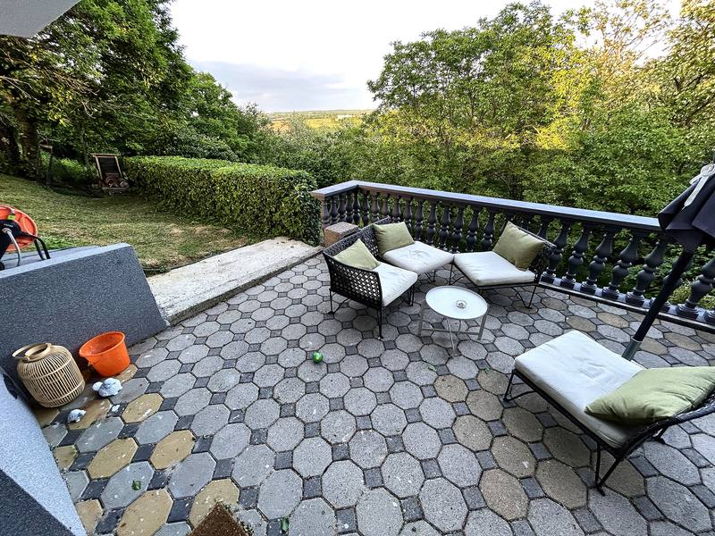 Covered terrace with a view of the hills